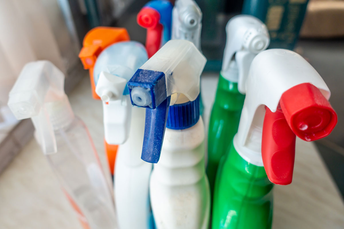 Household cleaning product bottles with custom warning labels