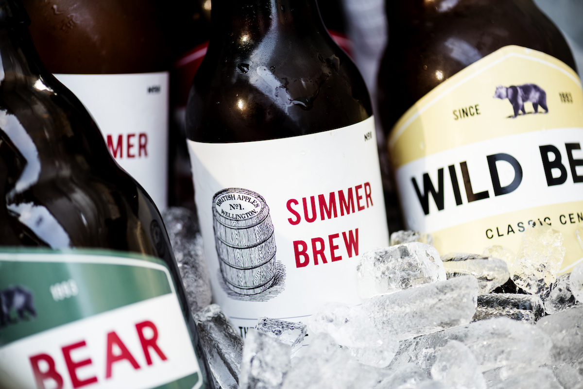 Craft beer bottles with summer-themed labels